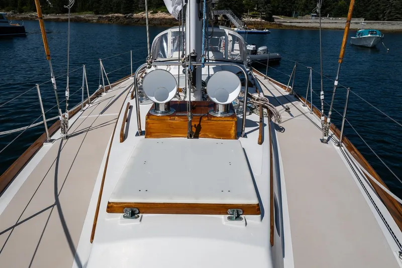 Slide: The Image of 1987 Hinckley Sou'wester 42 sailboat deck with polished wood and nautical equipment. - 11