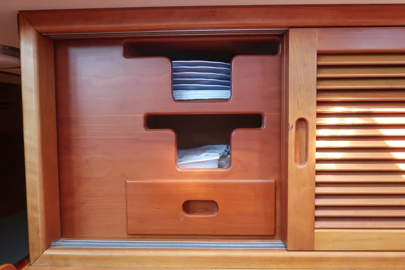 Slide: The Image of Wooden cabinet with sliding doors on a 1987 Hinckley Sou'wester 42 yacht. - 41