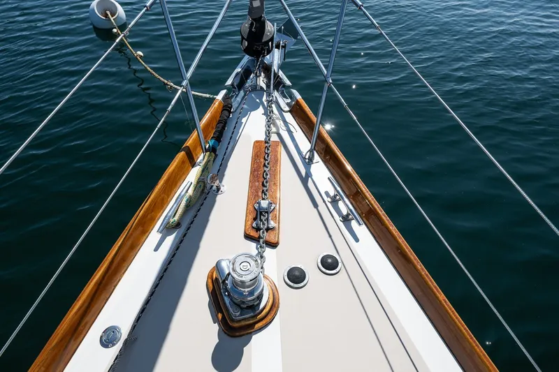 Slide: The Image of Bow of 1987 Hinckley Sou'wester 42 sailboat with polished wood and metal fittings. - 8