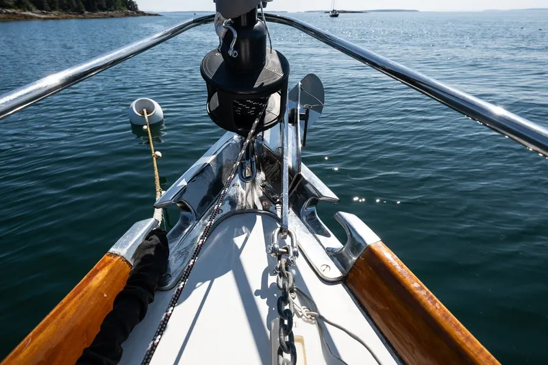 Slide: The Image of Bow of 1987 Hinckley Sou'wester 42 sailboat on calm water. - 9