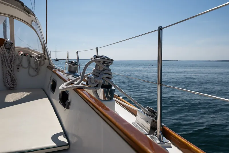 Slide: The Image of Hinckley Sou'wester 42 sailboat deck, 1987 model, with ocean view and clear sky. - 22