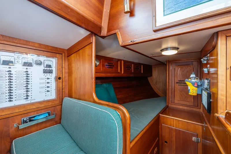 Slide: The Image of Interior of 1987 Hinckley Sou'wester 42 sailboat with wood paneling and control panel. - 29