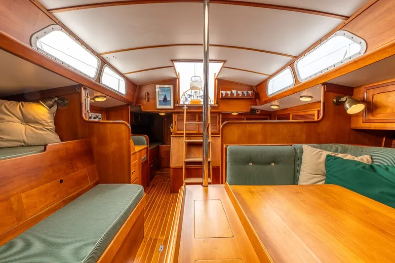 Slide: The Image of Interior of 1987 Hinckley Sou'wester 42 sailboat with wooden furnishings and seating. - 38
