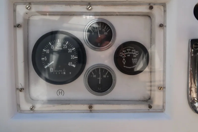 Slide: The Image of Hinckley Sou'wester 42 (1987) engine gauges, displaying RPM, temperature, and pressure readings. - 44