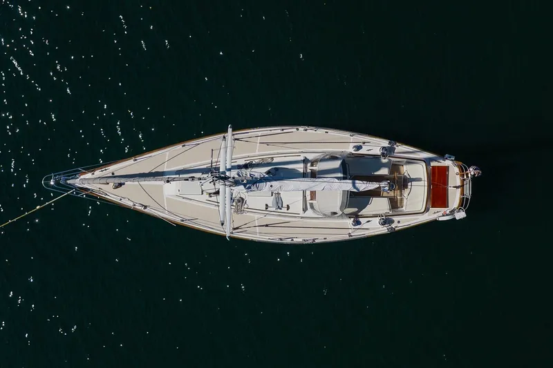 Slide: The Image of Aerial view of 1987 Hinckley Sou'wester 42 sailboat on dark water. - 5