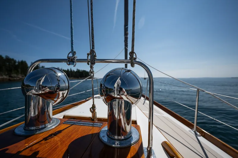 Slide: The Image of Hinckley Sou'wester 42 sailboat deck, 1987 model, with polished metal fittings and ocean view. - 47