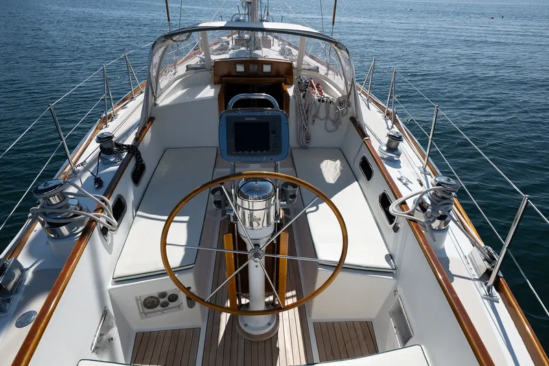 Slide: The Image of Cockpit of 1987 Hinckley Sou'wester 42 sailboat with wooden wheel and navigation equipment. - 20