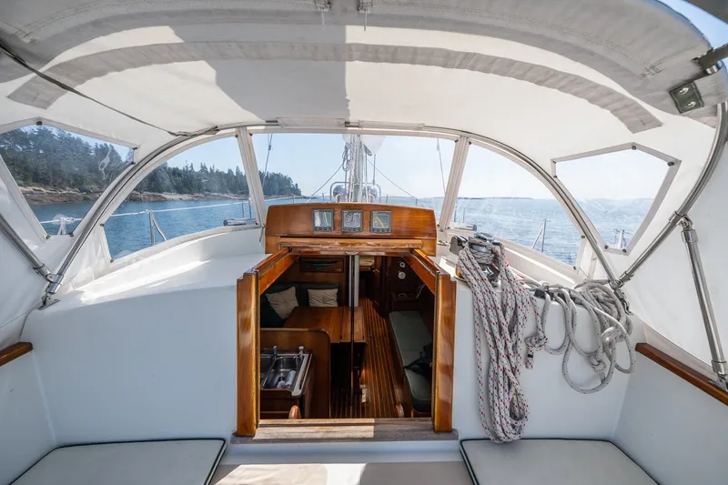 Slide: The Image of Cockpit view of 1987 Hinckley Sou'wester 42 sailboat with ocean backdrop. - 25