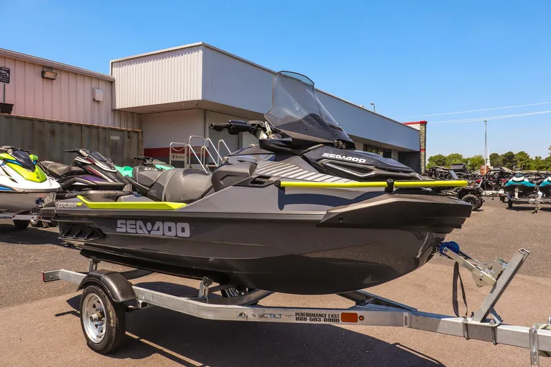 The Image of 2026 Sea-Doo Explorer Pro 170 jet ski on trailer, parked outdoors. - 1
