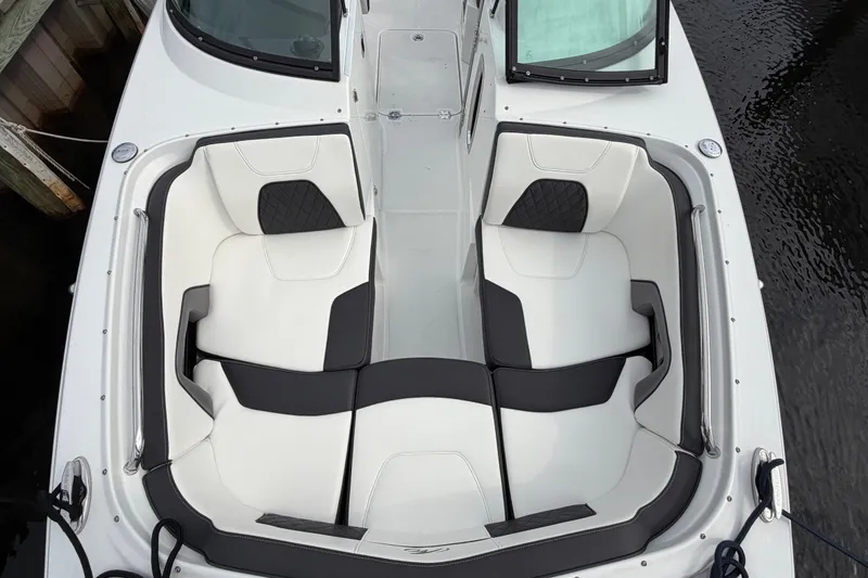 Slide: The Image of 2021 Monterey M-45 boat with white and black seating, docked by water. - 34