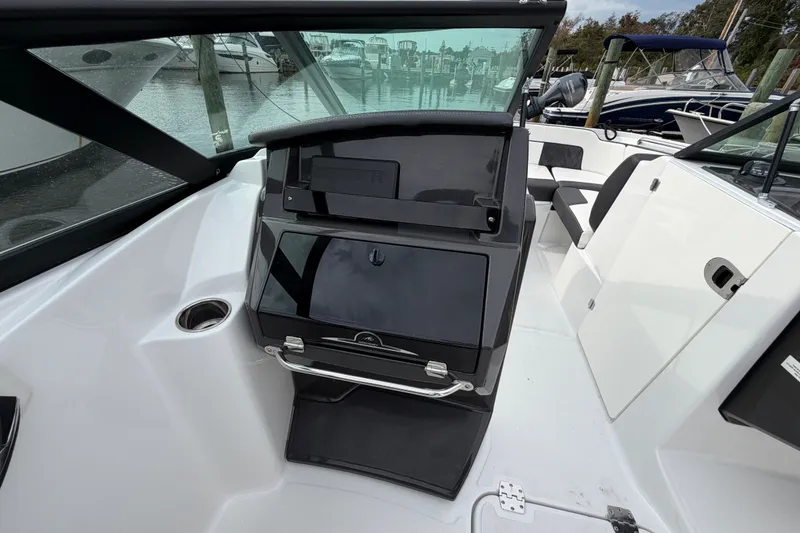 Slide: The Image of 2021 Monterey M-45 boat interior with seating and storage, docked at marina. - 31