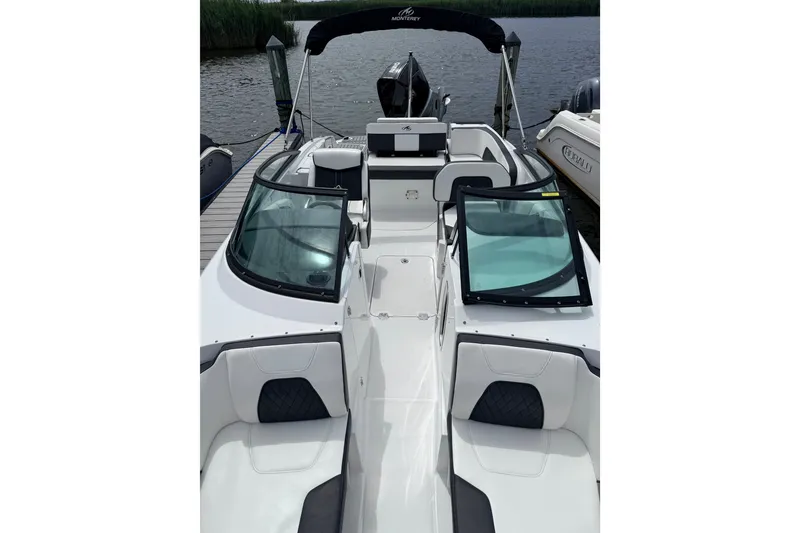 Slide: The Image of 2021 Monterey M-45 boat with sleek design, docked by the water. - 6