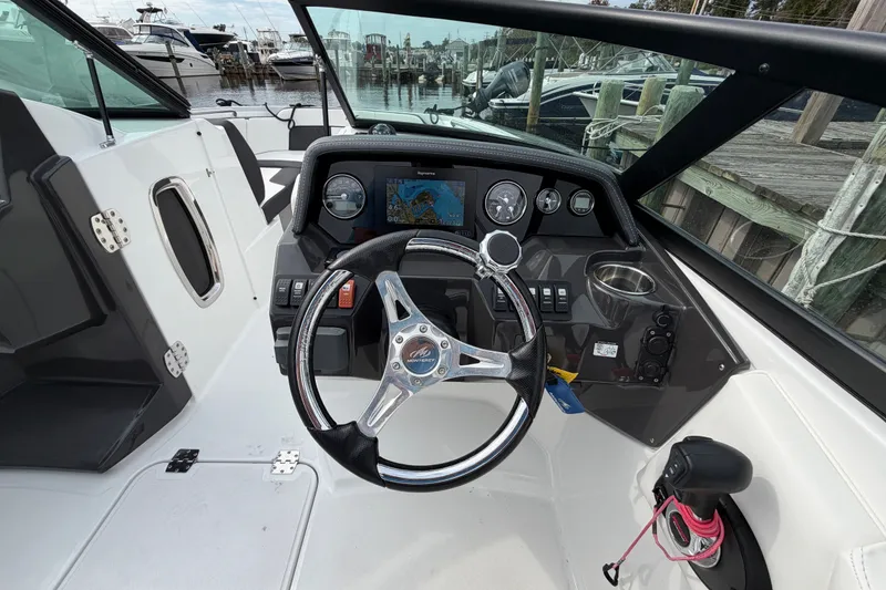 Slide: The Image of Cockpit of 2021 Monterey M-45 boat with steering wheel and navigation display. - 27