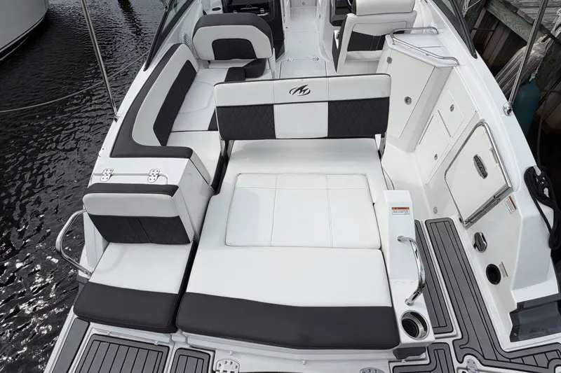 Slide: The Image of Luxury seating on a 2021 Monterey M-45 boat, featuring sleek black and white upholstery. - 16