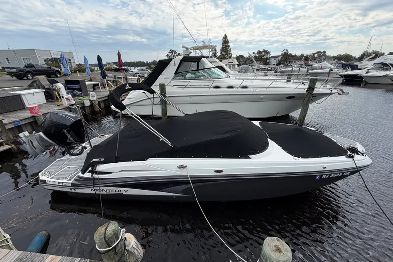 Slide: The Image of 2021 Monterey M-45 boat docked at marina, covered and ready for use. - 45