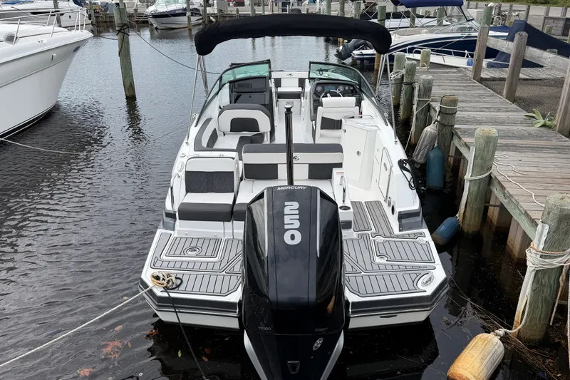 Slide: The Image of 2021 Monterey M-45 boat docked, featuring a powerful Mercury 250 engine. - 11