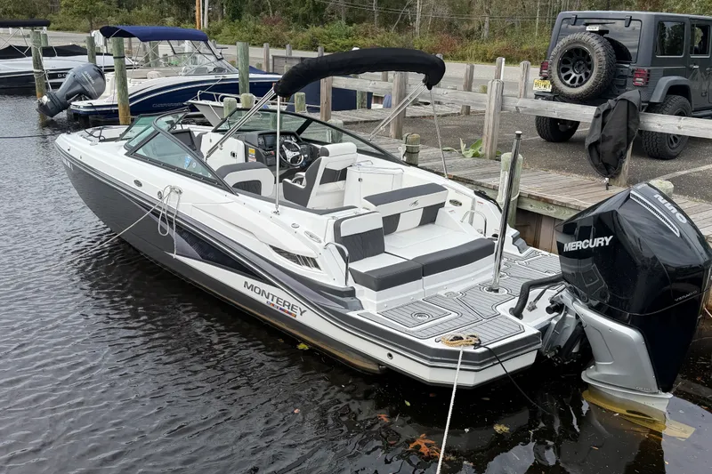Slide: The Image of 2021 Monterey M-45 boat docked with Mercury outboard engine. - 9