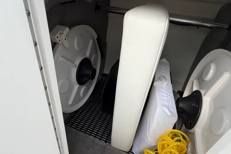 Slide: The Image of Storage compartment in a 2021 Monterey M-45 boat with life jackets and safety equipment. - 44