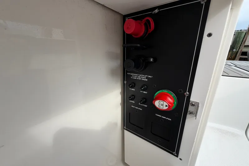 Slide: The Image of Control panel on a 2021 Monterey M-45 boat, featuring switches and emergency instructions. - 37