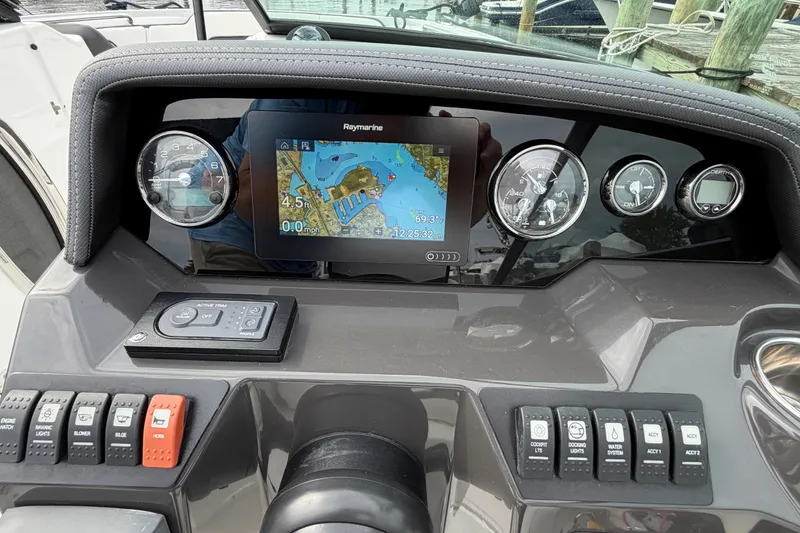 Slide: The Image of Dashboard of a 2021 Monterey M-45 boat with navigation display and controls. - 43