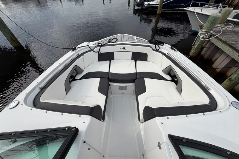 Slide: The Image of 2021 Monterey M-45 boat interior with cushioned seating at a dock. - 33