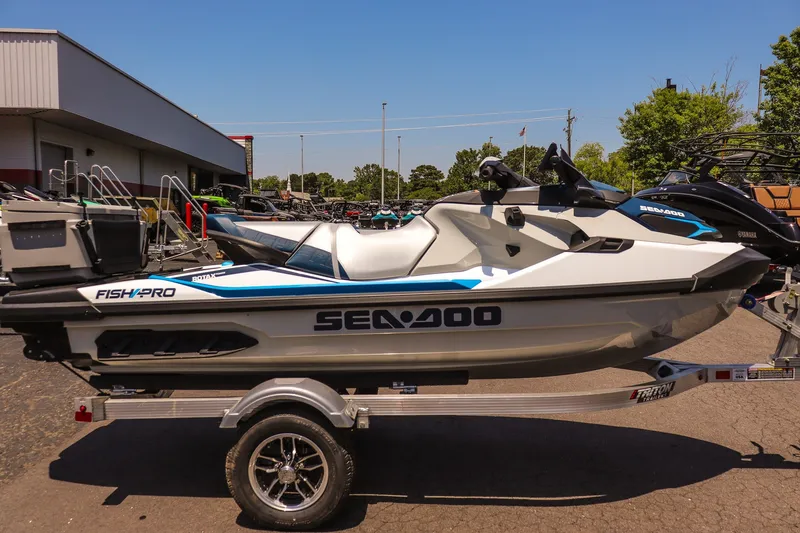 Slide: The Image of 2026 Sea-Doo FishPro Sport 170 on trailer, parked outdoors, side view. - 2