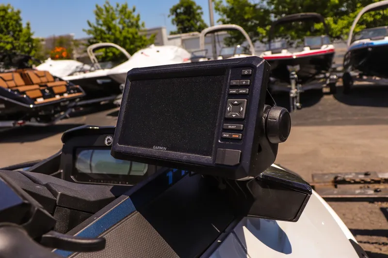 Slide: The Image of 2026 Sea-Doo FishPro Sport 170 with Garmin display, surrounded by boats in a marina. - 11