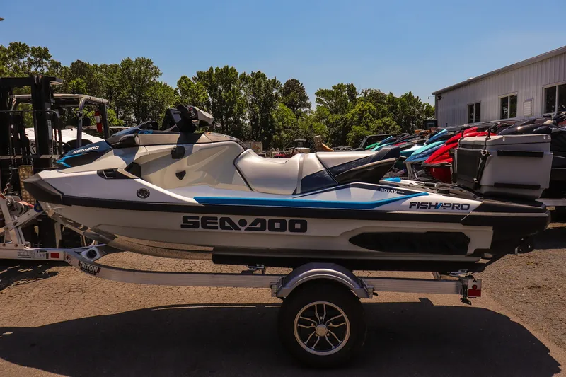Slide: The Image of 2026 Sea-Doo FishPro Sport 170 jet ski on trailer, parked outdoors. - 6
