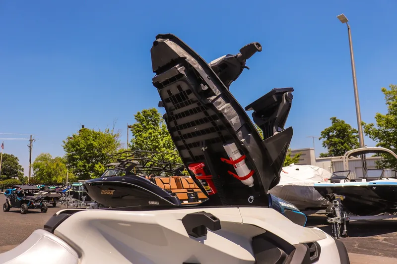 Slide: The Image of 2026 Sea-Doo FishPro Sport 170 with open storage compartment, outdoor display. - 12