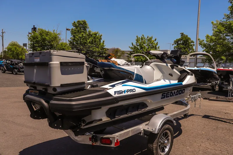 Slide: The Image of 2026 Sea-Doo FishPro Sport 170 on trailer, parked outdoors, showcasing sleek design and storage features. - 3