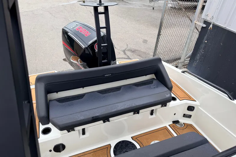 Slide: The Image of Boat interior with Iron 707 model, featuring seating and outboard motor, 2024 design. - 19