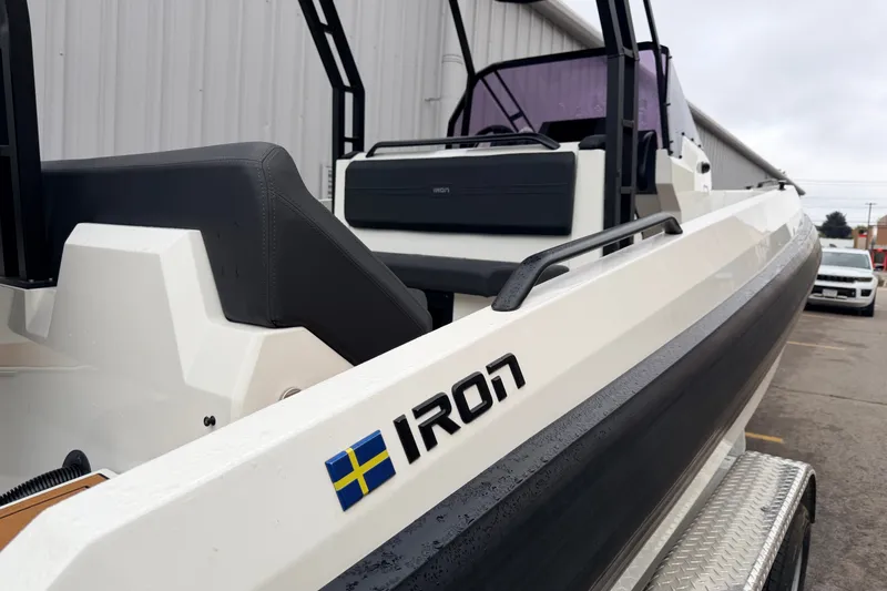 Slide: The Image of 2024 Iron 707 boat with sleek design, featuring Swedish flag emblem. - 16