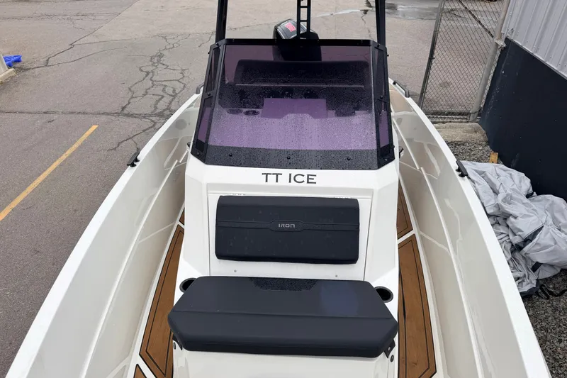 Slide: The Image of 2024 Iron 707 boat with sleek design, featuring a modern cockpit and wooden deck accents. - 18