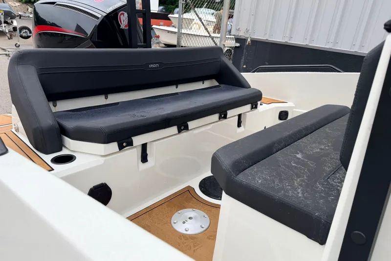 Slide: The Image of 2024 Iron 707 boat interior with black seating and modern design. - 14