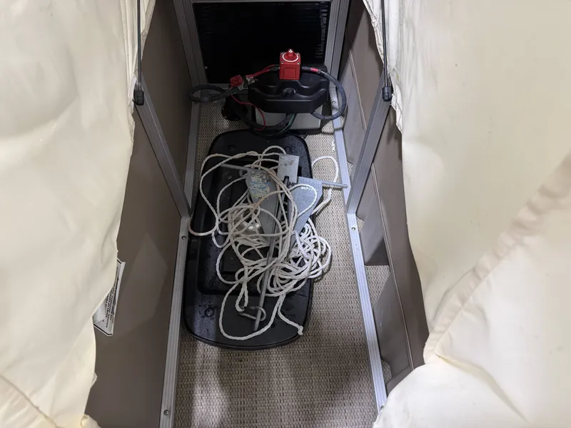 Slide: The Image of A narrow passageway with ropes and a battery on the floor. - 17