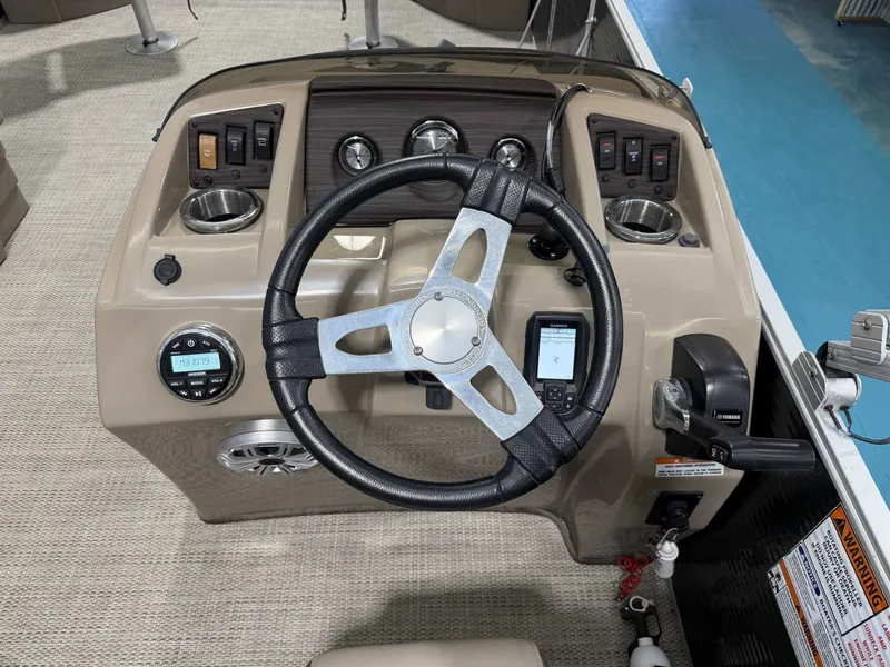 Slide: The Image of The image shows the helm of a 2020 Bennington 22SFXAPG with a steering wheel and gauges. - 14