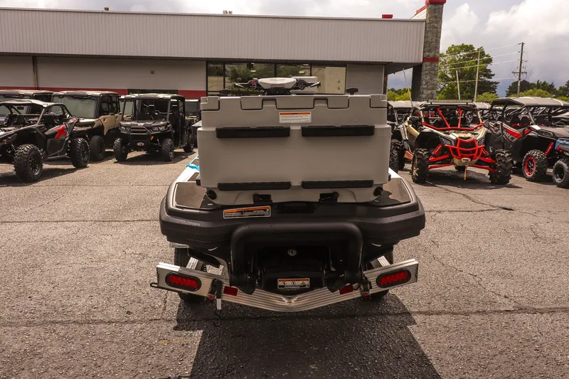 Slide: The Image of 2026 Sea-Doo FishPro Sport 170 rear view in dealership lot, surrounded by off-road vehicles. - 6
