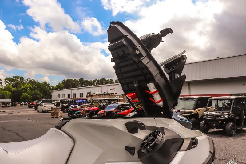 Slide: The Image of 2026 Sea-Doo FishPro Sport 170 with open storage compartment, parked outdoors. - 13
