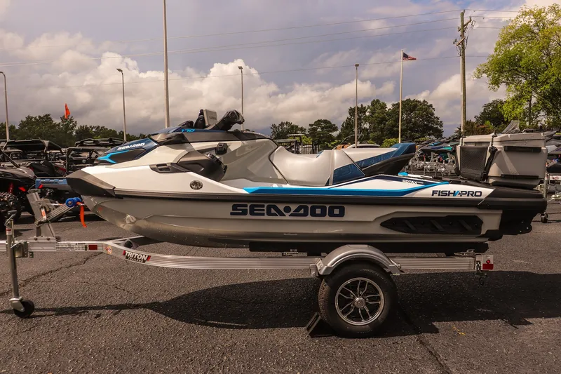 Slide: The Image of 2026 Sea-Doo FishPro Sport 170 on trailer, parked outdoors under cloudy sky. - 8