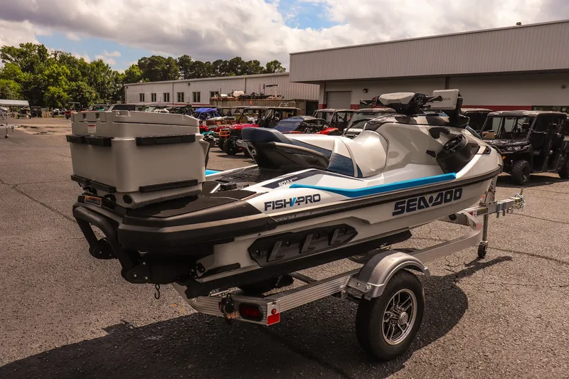 Slide: The Image of 2026 Sea-Doo FishPro Sport 170 on trailer, parked outdoors, showcasing sleek design and storage features. - 5