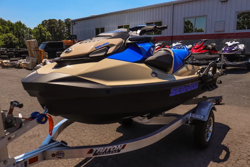 Slide: The Image of 2026 Sea-Doo Wake 170 jet ski on trailer, parked outdoors. - 7