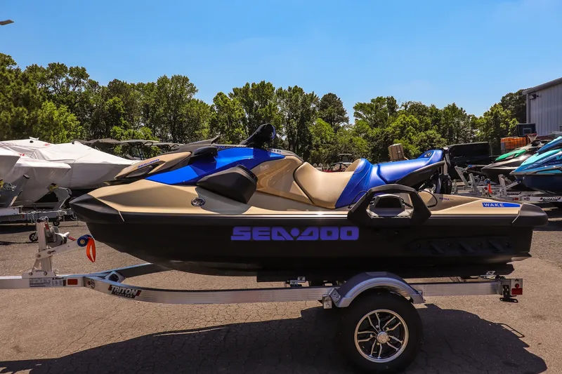 Slide: The Image of 2026 Sea-Doo Wake 170 jet ski on trailer, parked outdoors. - 6