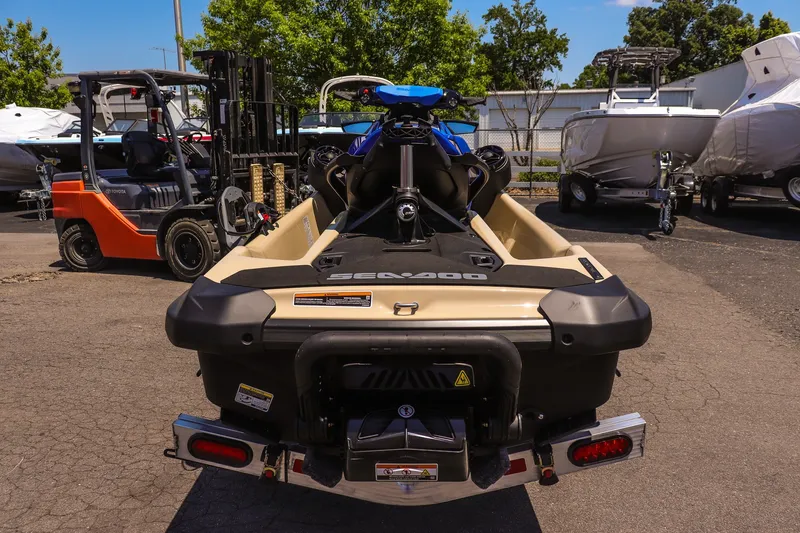 Slide: The Image of 2026 Sea-Doo Wake 170 jet ski parked outdoors, rear view. - 4