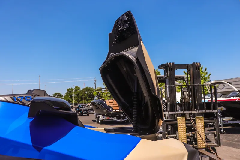Slide: The Image of 2026 Sea-Doo Wake 170 with open storage compartment, displayed outdoors under clear blue sky. - 14
