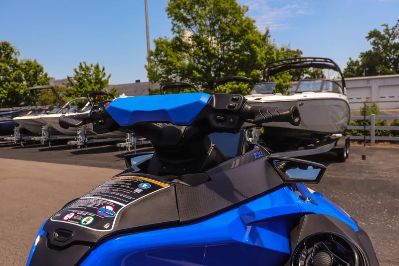 Slide: The Image of 2026 Sea-Doo Wake Pro 230 jet ski, blue, parked near boats, sunny day. - 10