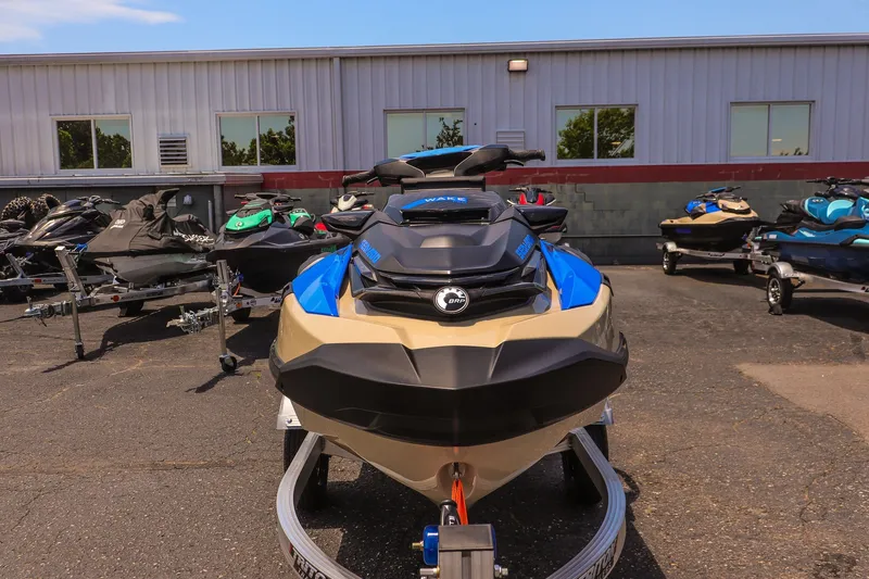 Slide: The Image of 2026 Sea-Doo Wake Pro 230 jet ski displayed outdoors on a trailer. - 8