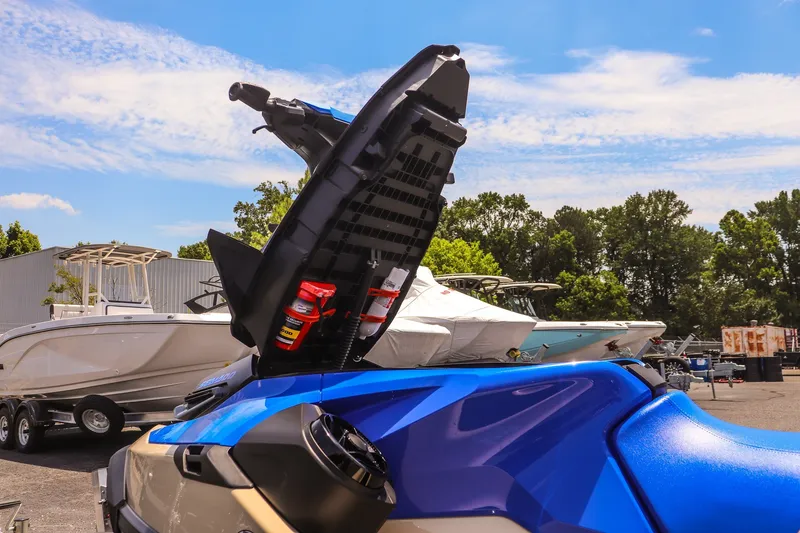 Slide: The Image of 2026 Sea-Doo Wake Pro 230 with open storage compartment, showcasing vibrant blue design. - 15