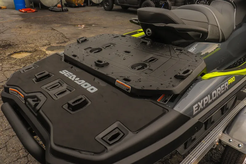 Slide: The Image of 2026 Sea-Doo Explorer Pro 230 jet ski, rear view, showcasing storage platform and seating. - 14