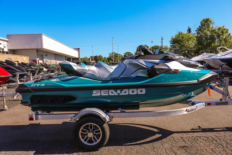 Slide: The Image of 2026 Sea-Doo GTX Limited 325 jet ski on trailer, displayed outdoors. - 2