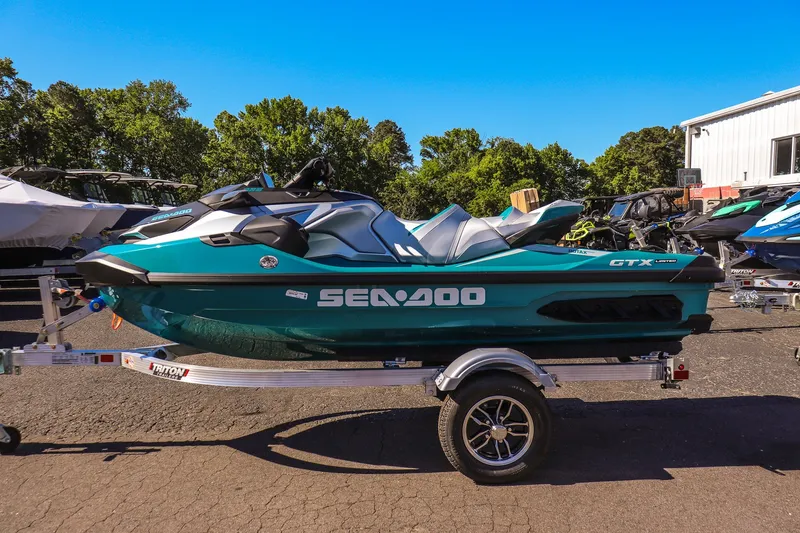 Slide: The Image of 2026 Sea-Doo GTX Limited 325 jet ski on trailer, parked outdoors. - 6